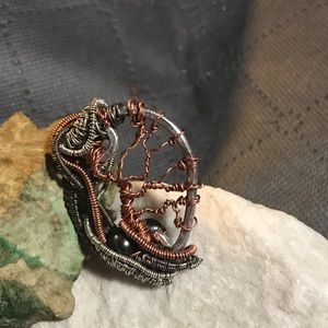 Handmade wire wrapped pendant with freshwater peacock pearl.